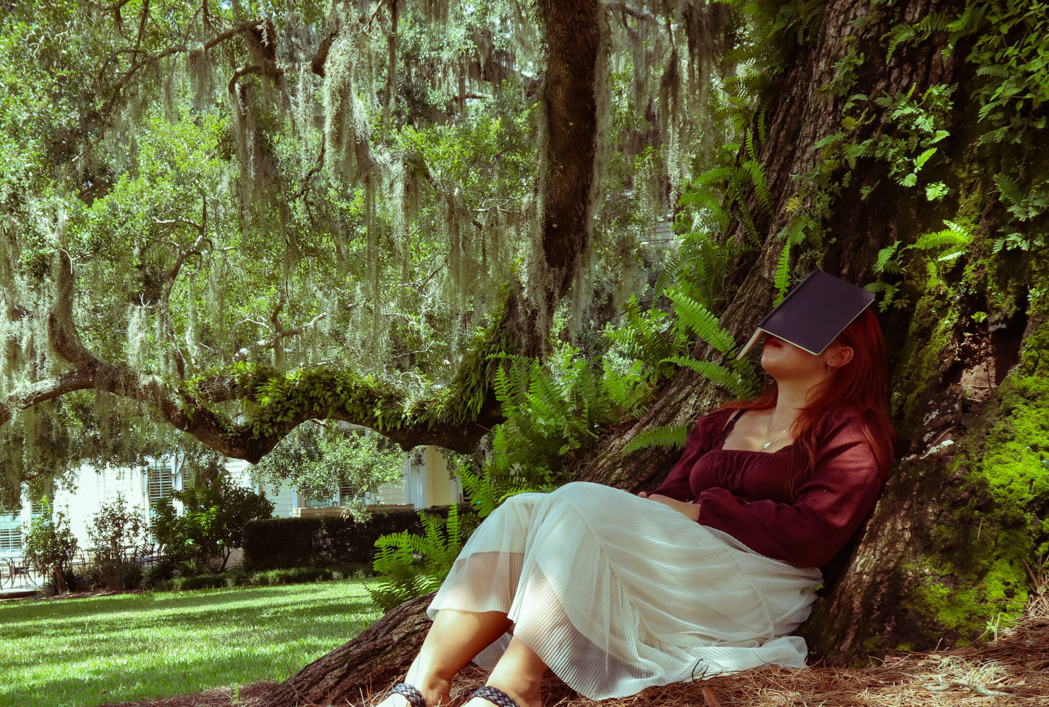 girl sleeping by tree